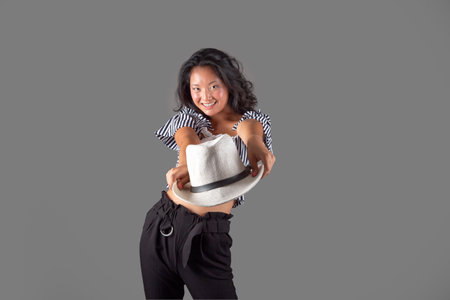 nice chinese woman in a white hat, isolated from the backgroundの写真素材