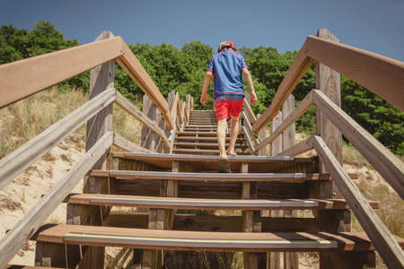 Boy hiking along dune succession trail in Indiana Dunes National Park.の写真素材