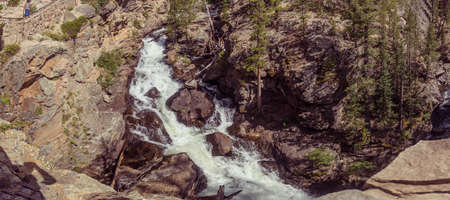 Adams Falls - 55 foot waterfall flowing through a gorge in Rocky Mountain National Parkの写真素材