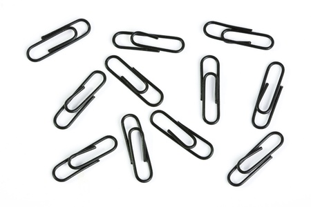 A group of black paper clips on white background.の写真素材