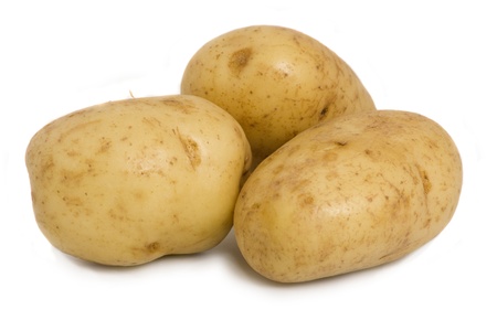 Three potatoes isolate on a white background.の写真素材