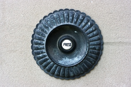 Press Victorian Doorbell on grey stone wall
