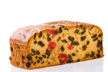 delicious succulent fresh  fruit cake with mixed fruit and cherries on white background.の写真素材