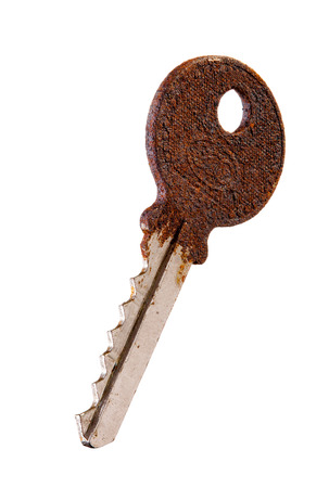 Old rusty key isolated on white background の写真素材