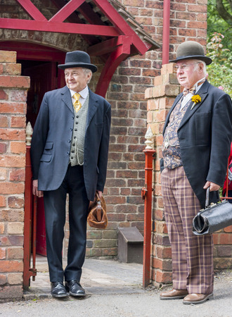 ENGLAND - 21st July 2012 : Two men dressed as Victorian  banker and Victorian doctor at Blists hill open air museum.のeditorial素材