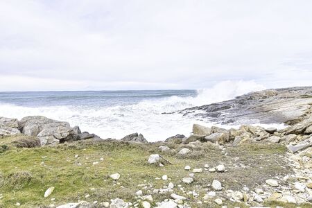 choppy sea and waves along the coast in northern Spainの写真素材