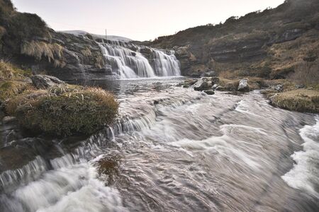 beautiful waterfall raging down into the valley in spainの写真素材
