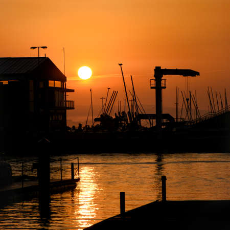 golden sunrise on the pier over the sea in Spainの写真素材
