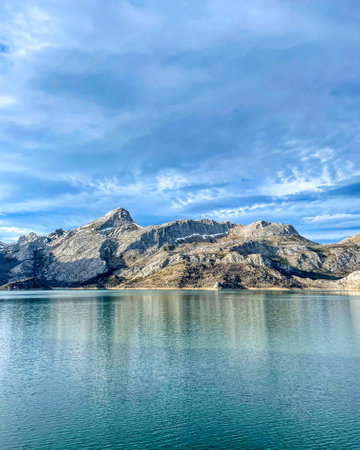 mountain reflected on the lake with snow and cold in spainの写真素材