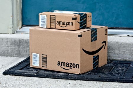 MARYLAND, USA - JANUARY 18, 2016: Image of Amazon packages delivered to a home. Amazon is the largest internet based retailer in the United States.のeditorial素材