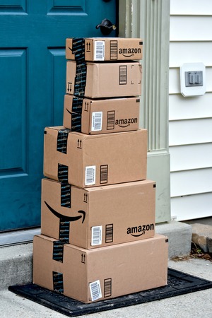 MARYLAND, USA - JANUARY 18, 2016: Image of Amazon packages delivered to a home. Amazon is the largest internet based retailer in the United States.のeditorial素材