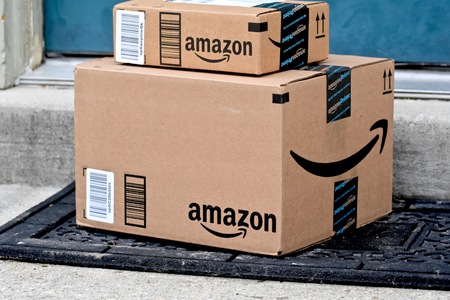 MARYLAND, USA - JANUARY 18, 2016: Image of Amazon packages delivered to a home. Amazon is the largest internet based retailer in the United States.のeditorial素材