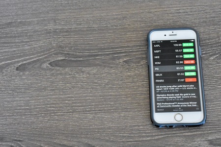 Maryland, USA - APRIL 3, 2016: An Apple iPhone 6s displaying stock market information on the stocks application. The iPhone is a product of Apple Inc.のeditorial素材