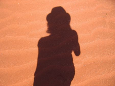 Shadow of a tourist in the desertの写真素材