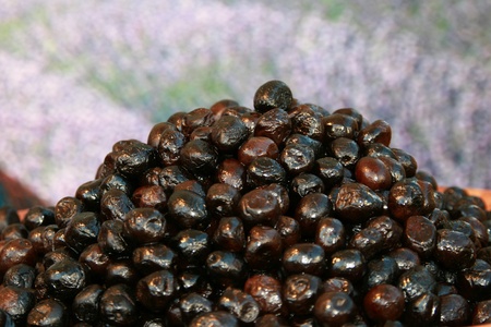 Black olives to be tasted on a marketの写真素材
