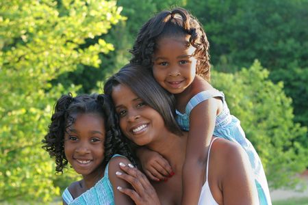 An african american mother and her daughtersの写真素材