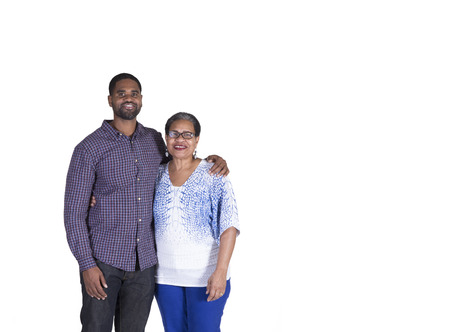 Portrait of a elderly woman and her grown adult son isolated on whiteの写真素材