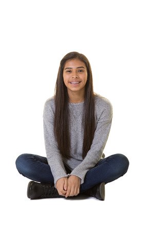 Portrait of a young teen isolated on whiteの写真素材