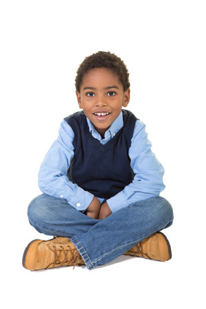 Portrait of a school aged boy isolated on whiteの写真素材