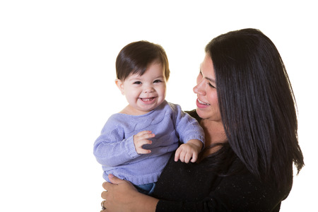 Portrait of a mother holding her infantの写真素材