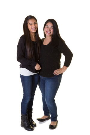 A mother and her teenage daughter isolated on whiteの写真素材