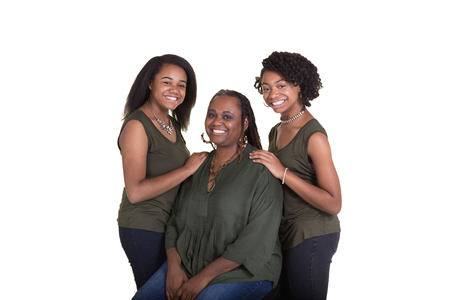 A mother and her teenage daughters isolated on whiteの写真素材