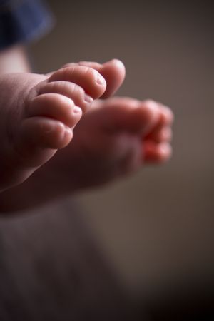 closeup or macro image of little baby feet, with space for writingの写真素材