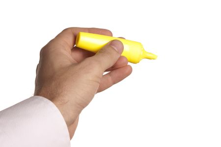 man holding a yellow marker pen in his handの写真素材