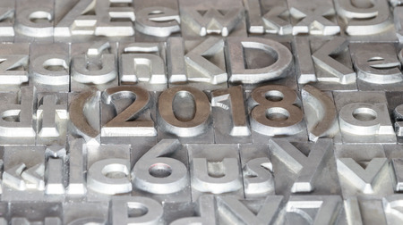 Happy 2018 between other types of pressの写真素材