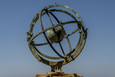 Armillar sphere on a blue background in Bayona, Spainの写真素材