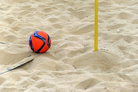 The ball is in the corner waiting to be kicked on a beach soccer fieldの写真素材