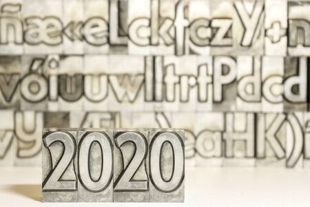 Happy new year 2020 on background with press typesの写真素材