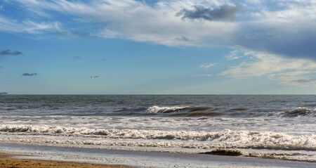 Landscape of an Andalusian beach with a beautiful cloudy sky in the background