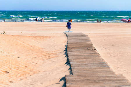 Wooden walkway in the sand on a Spanish beach to access the Atlantic Oceanの写真素材