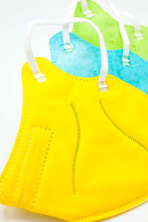 Color masks ffp2 on white background. protection.