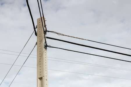 electricity post with blue sky and white cloud background, Thailand.の写真素材
