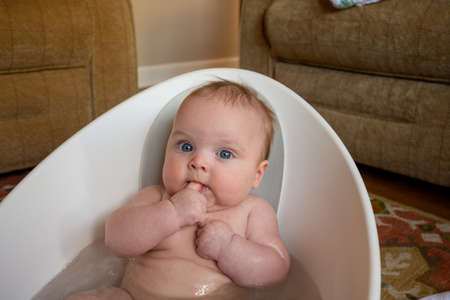 Chubby baby in bathの写真素材