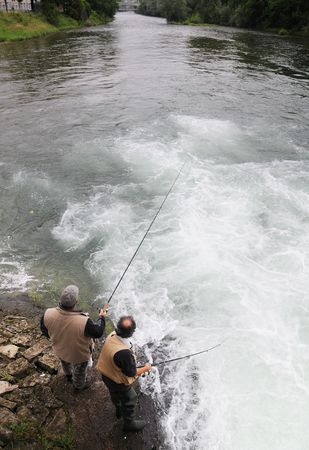2 Man fishing by the river