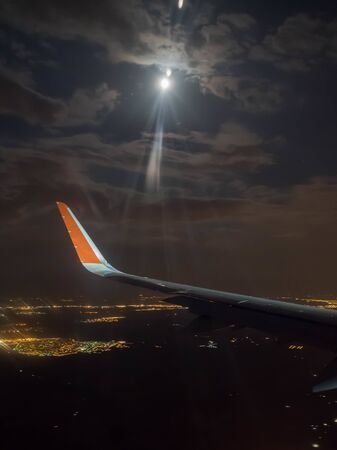 view of the plane wing duskの写真素材