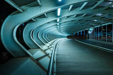 bridge with tubular structure, illuminated without peopleの写真素材