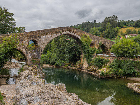 peculiar stone bridge over a riverの写真素材