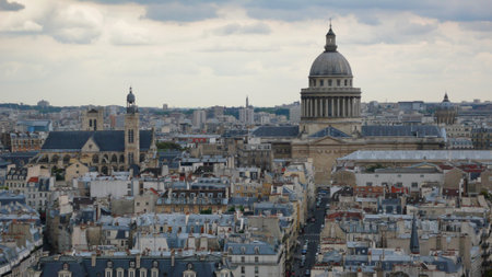 Paris rooftops with the Pantheon: A sweeping view of the Parisian skyline from above, dominated by the iconic dome of the Pantheon and classic Haussmann buildings.の写真素材