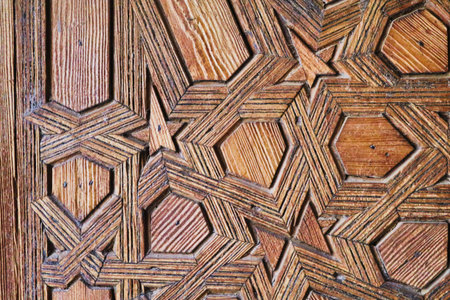 Intricate Moroccan wooden door detail - A close-up shot of an intricate, traditional Moroccan wooden...