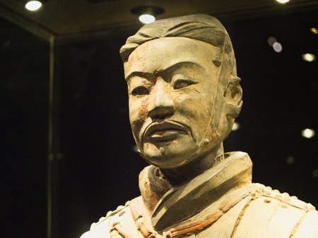 Terracotta Warrior Profile with Reflection - A striking profile shot of a Terracotta Warrior statue,...