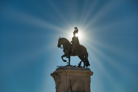 King Jose I Statue Silhouetted Sunburst - Dramatic low-angle silhouette of the bronze equestrian...