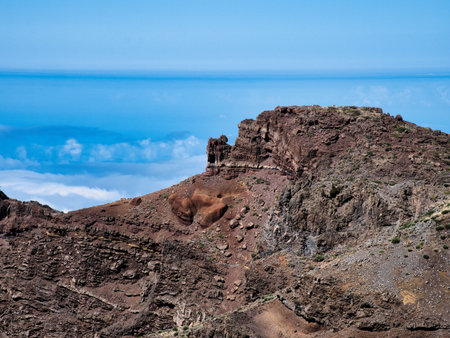 Dwarf Echium Bloom Above Cloud Sea - Dry, towering Echium bloom on red volcanic rock high above a dense sea of clouds at the mountain summit of La Palma.の写真素材