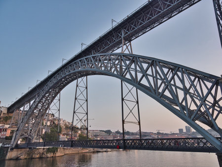Dom LuÃ­s I Bridge and Porto Skyline at Sunset - High-angle view of the iconic metal arch bridge...