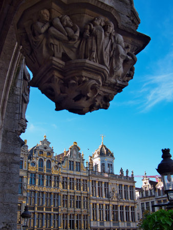 Historic guildhall view from Grand Place, Brussels - Architectural detail of the ornate guildhalls on the famous main square in Brussels, Belgium, under a clear blue sky.の写真素材