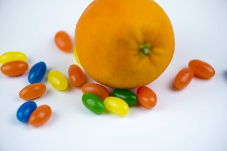 orange wrapped among jewish-shaped trinketsの写真素材