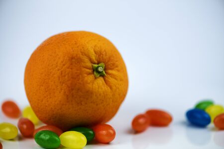 orange wrapped among jewish-shaped trinketsの写真素材